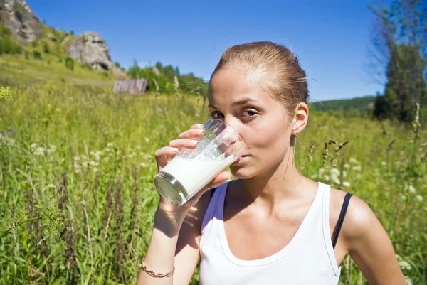 Girl drinks milk. — Stock Photo, Image