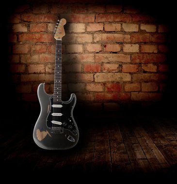 Electric guitar in the room clipart