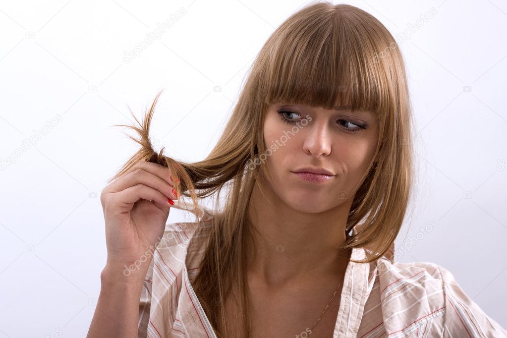 Women holding bad hair in his hands