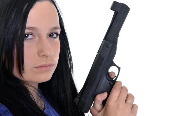 Mujer con un arma aislada sobre un fondo blanco —  Fotos de Stock