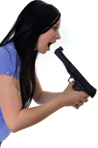 Nő egy pisztolyt, elszigetelt fehér background — Stock Fotó