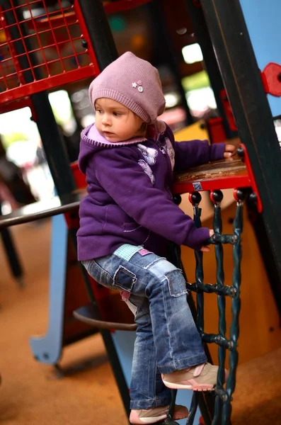 Small girl playing on children's playground — Stock Photo, Image