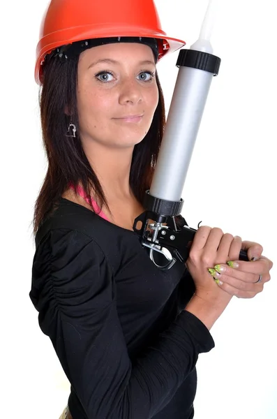 Woman with caulking gun — Stock Photo, Image