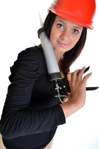Mulher com arma de calafetagem — Fotografia de Stock