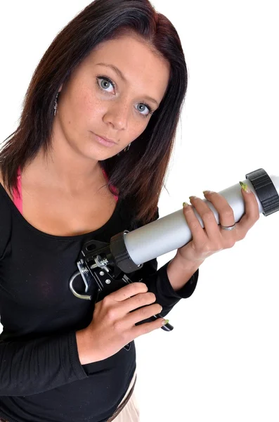 Mulher com arma de calafetagem — Fotografia de Stock