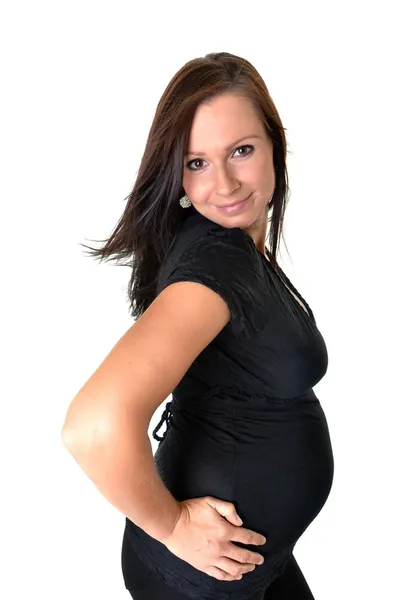 Έγκυος γυναίκα χαϊδεύει την κοιλιά της πάνω από λευκό φόντο — Φωτογραφία Αρχείου