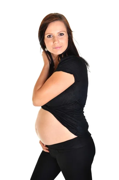 Terhes nő simogatja hasát fehér háttér — Stock Fotó
