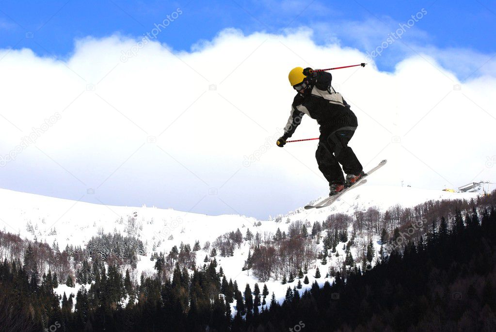 Flying freeskier on mountains