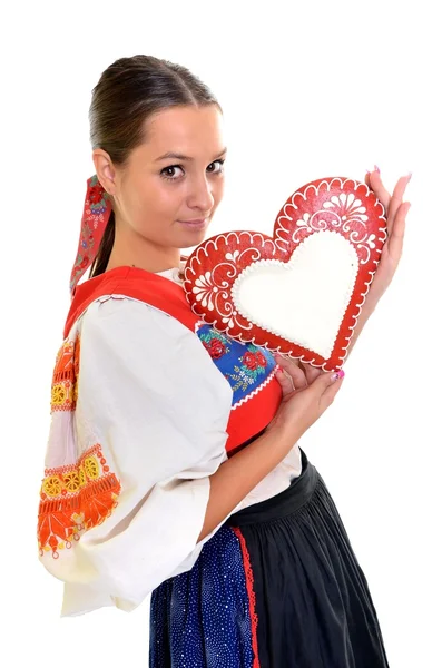 Vacker flicka visar en Pepparkaka hjärta — Stockfoto