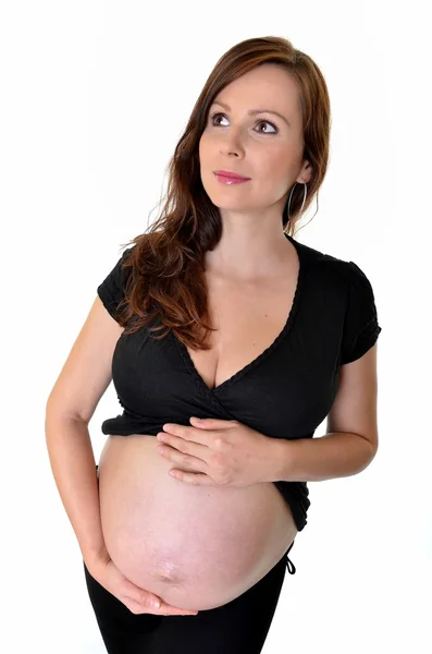 Беременная женщина изолирована на белом фоне — стоковое фото