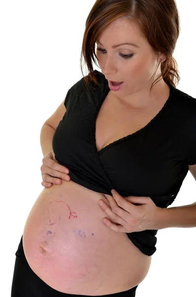 Mujer embarazada aislada sobre fondo blanco — Foto de Stock