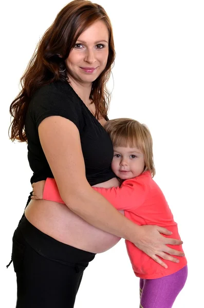 Jonge moeder leert toekomstige baby — Stockfoto