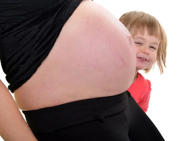 Fiatal anya tanítja a jövőbeli baba — Stock Fotó