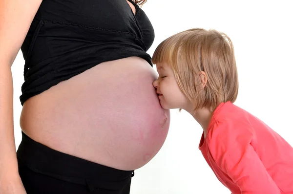 Jovem mãe ensina futuro bebê — Fotografia de Stock