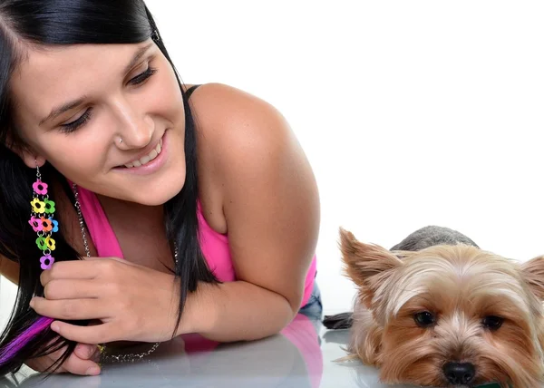 Young woman and sweet puppy playing around — Stock Photo, Image