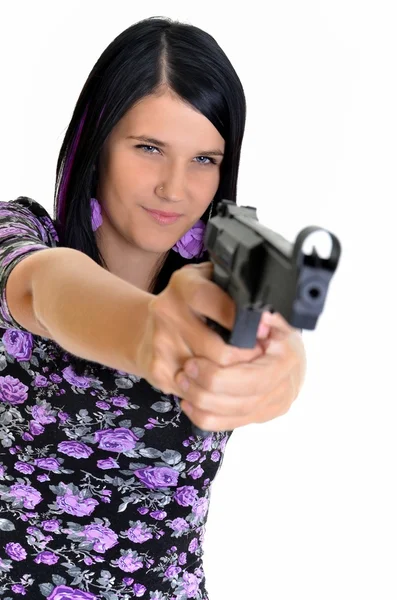 Mujer con un arma aislada sobre un fondo blanco —  Fotos de Stock
