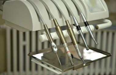 Dentists instruments in the clinic clipart