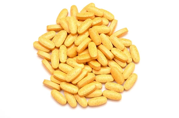 Bunch of capsules on white background — Stockfoto