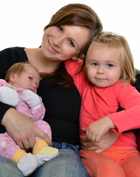 Foto de madre feliz con sus hijas sobre blanco — Foto de Stock