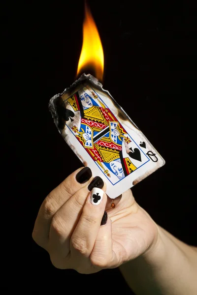 Burning the queen of spades. — Zdjęcie stockowe
