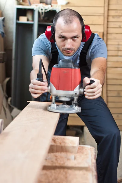 Worker with a router, vertical. — Stock Photo, Image