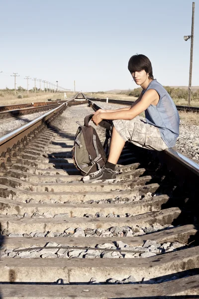 Teen boy on rail road — Stock Photo, Image