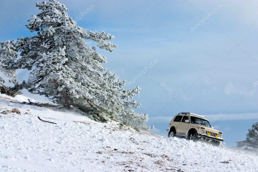 Off-road car on winter landscape