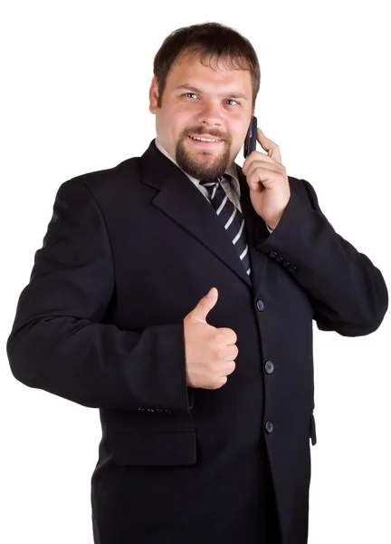 Hombre de negocios hablando en un teléfono celular y aparece pulgar — Foto de Stock