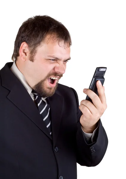 Businessman shouting into a mobile phone — Stock Photo, Image