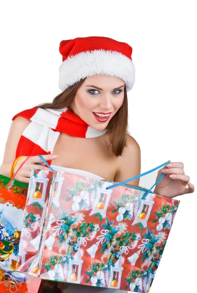 Mulher bonita no vestido de Natal abre com saco de compras — Fotografia de Stock