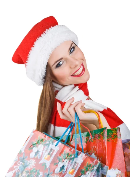 Mooie vrouw in Kerst outfit met shopping tassen — Stockfoto