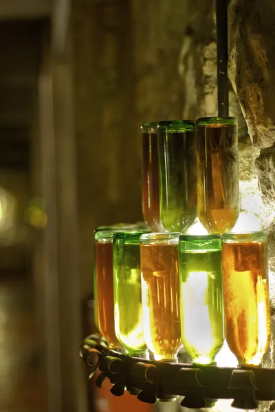 stock image Chandelier of bottles of the wine in wine vault cellar