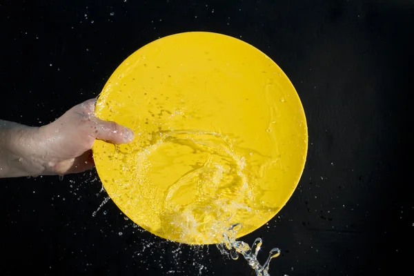 stock image Splash water on a plate