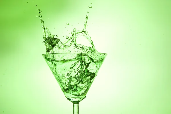 Splashing green cocktail — Stock Photo, Image