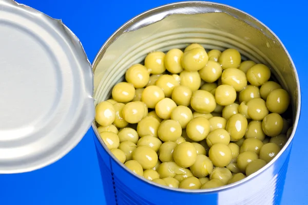 stock image Jar of greenpreserved pea isolated on blue