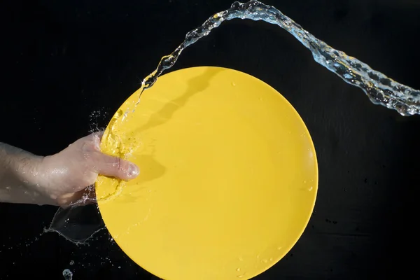 Espalhe a água em uma chapa — Fotografia de Stock