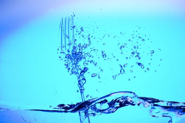Tenedor en el agua azul —  Fotos de Stock