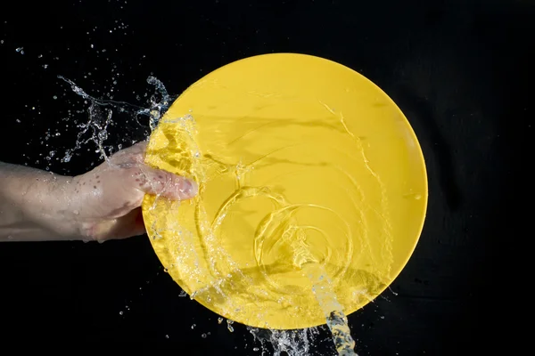 stock image Splash water on a plate