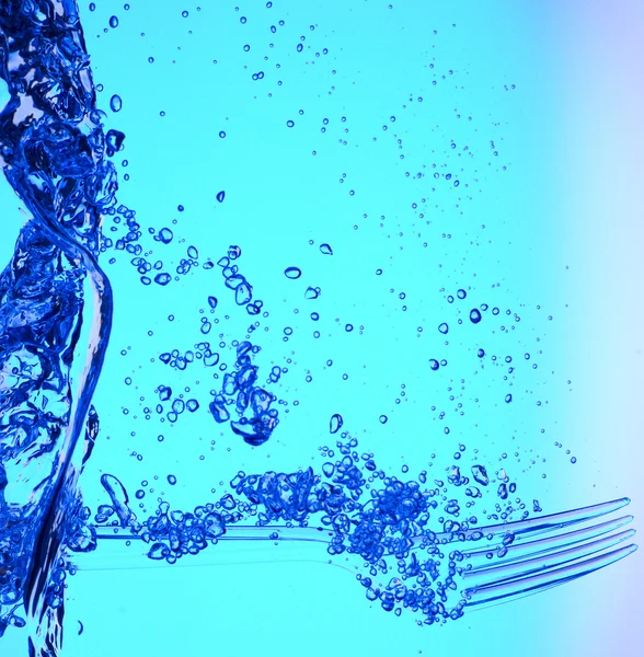 Garfo na água azul — Fotografia de Stock