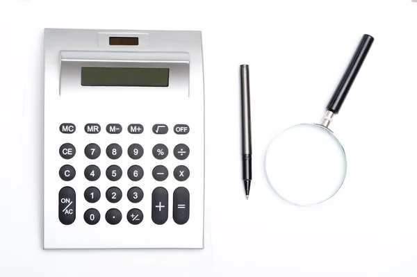 Kalkulator og penn – stockfoto