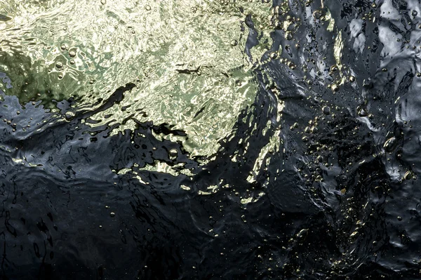 Superfície de água dourada — Fotografia de Stock