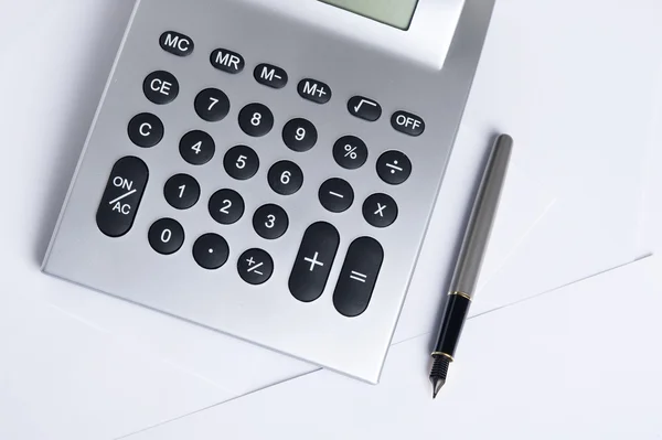 Calculator with pen — Stock Photo, Image