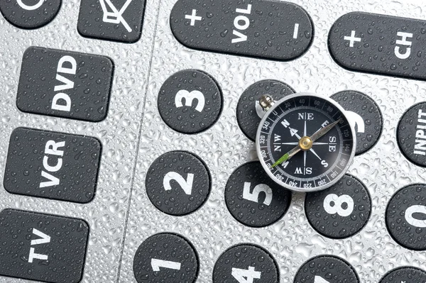 Compass and remote control — Stock Photo, Image