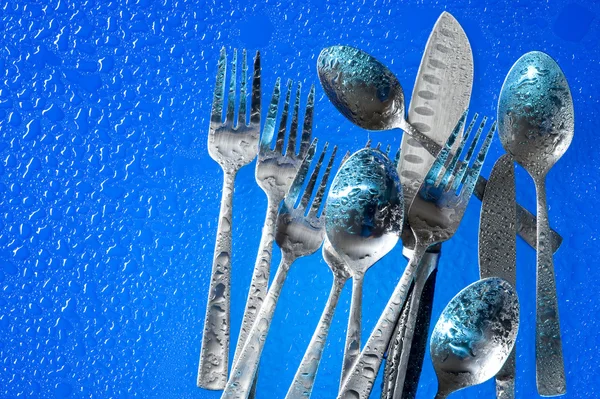 Fork on blue background — Stock Photo, Image