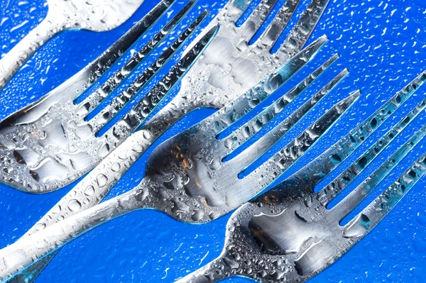 Fork on blue background — Stock Photo, Image