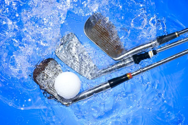Golf club in blue water — Stock Photo, Image