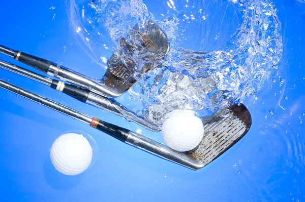 Golf club in blue water Stock Photo