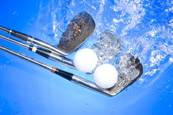 Golf club in blue water Stock Image