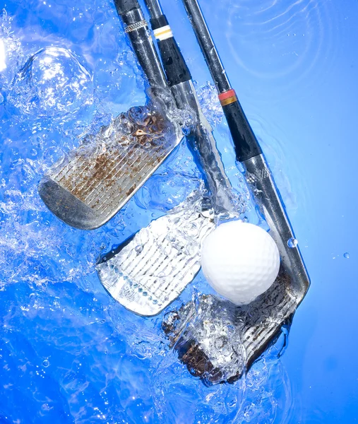 Golf club in blue water Stock Picture