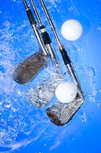 Golf club in blue water Stock Photo